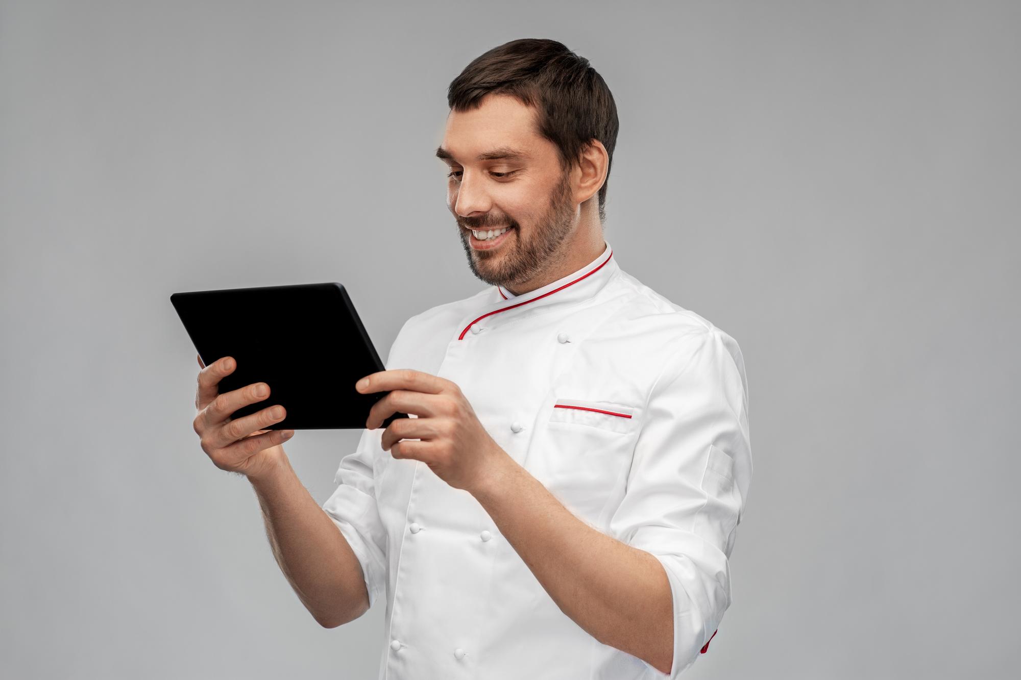 Consultation setting with chef and tablet in a clean studio